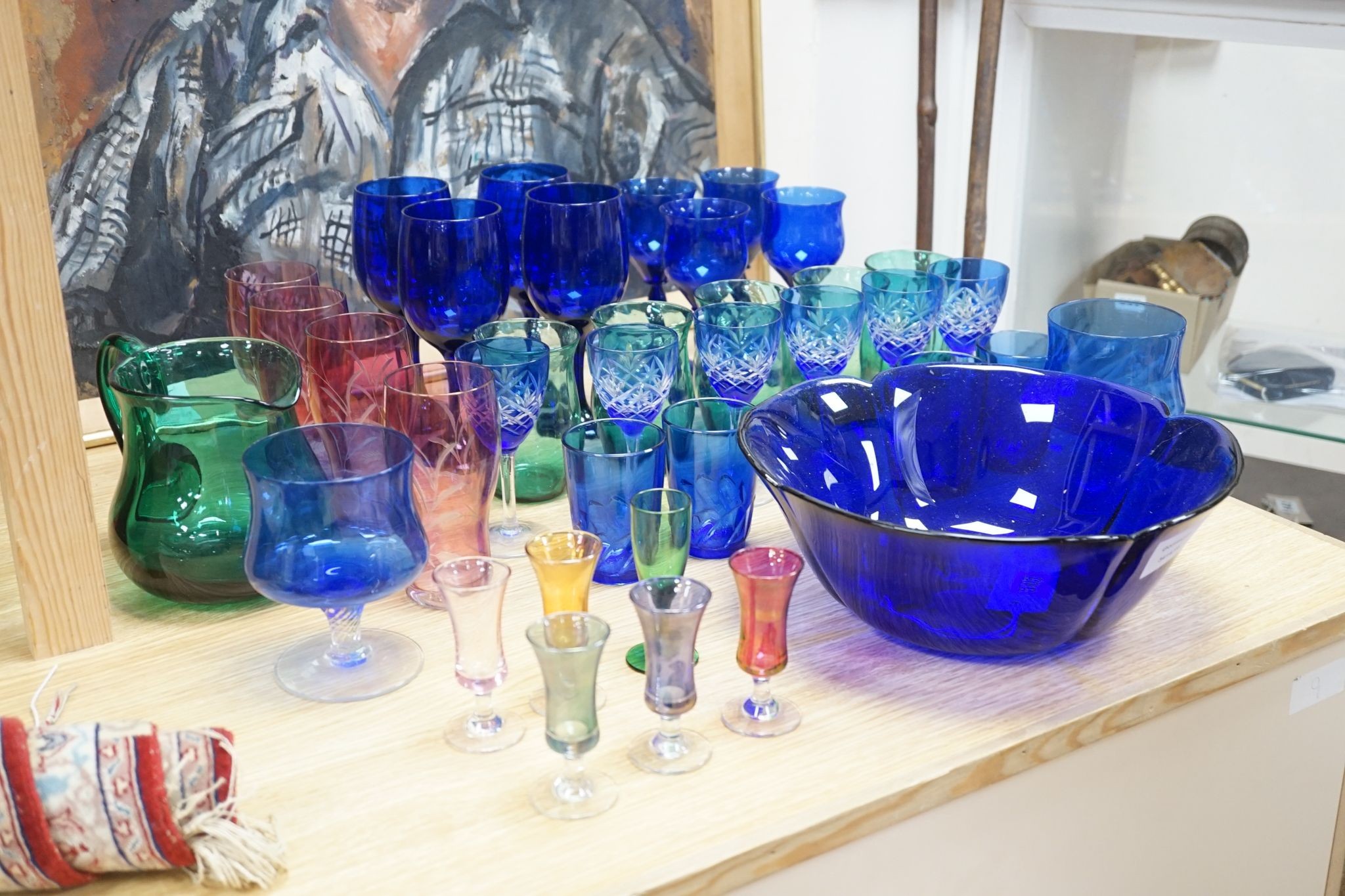 A mixed group of coloured glassware